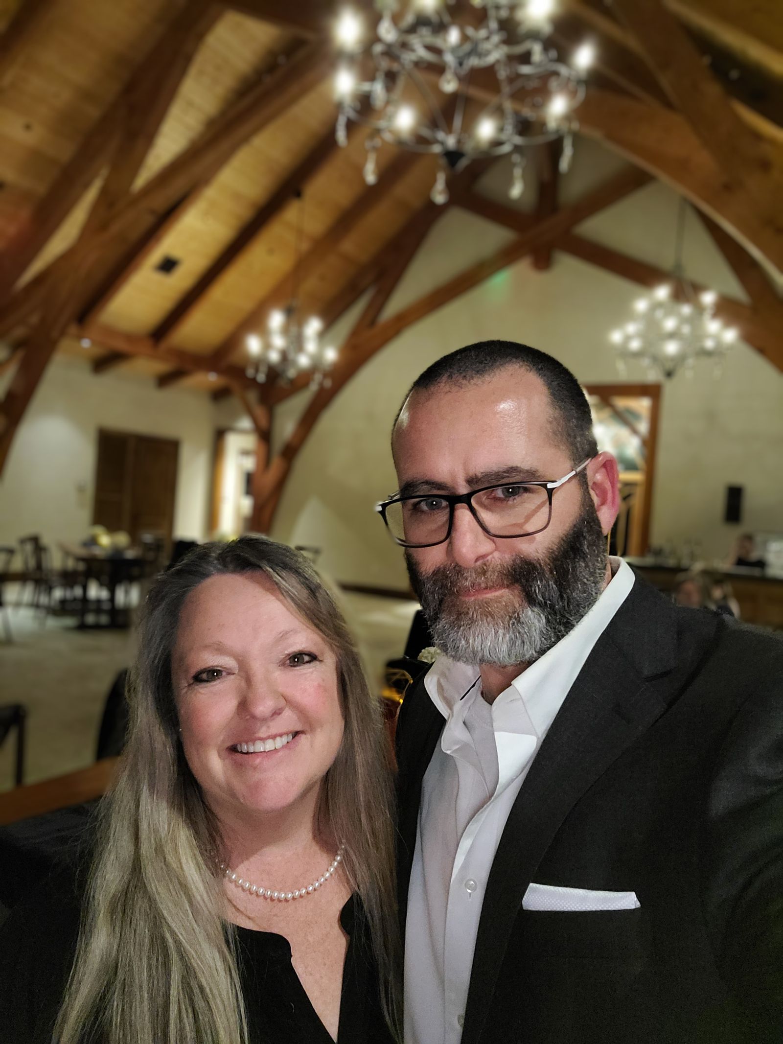 My and my wife at a wedding.